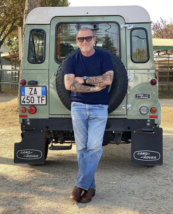 Navy T-Shirt with Blue Jeans and Brown Boots 